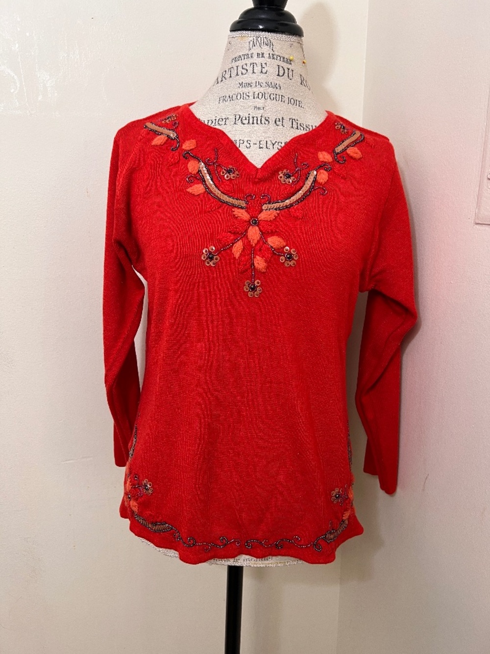 'Celebrate' vintage red pullover wool sweater characterized by a v-neckline